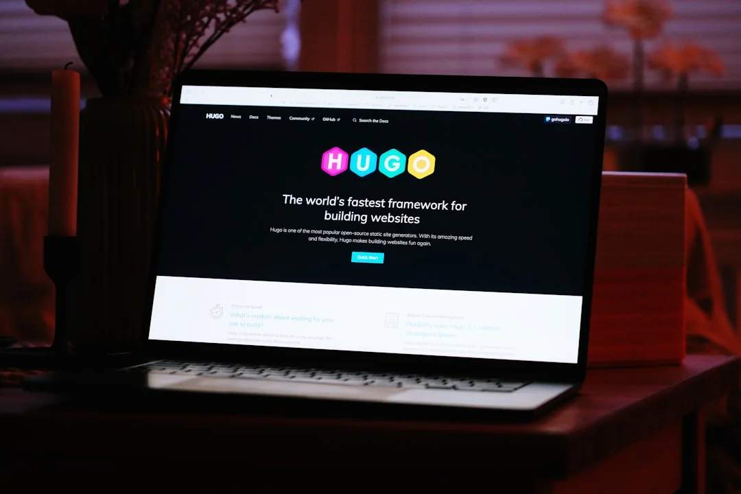 A woman makes an online purchase using a credit card on her laptop, browsing an online fashion store.